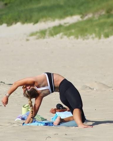 Maddy, founder of The Salt Mat Co, mid-class on a Block Island beach